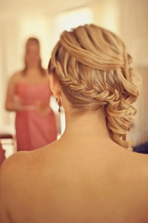 a half updo with a braided ponytail and waves on top is a unique and versatile hairstyle