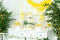 a lovely dessert table with yellow sweets