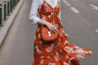 13 a bright and cool look with a white shirt, an orange floral print midi dress, white sneakers and an orange bag for a summer to fall wedding
