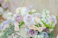 14 a chic and delicate wedding bouquet with lilac and blush roses, greenery and simple white blooms for a spring wedding