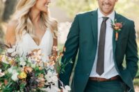 17 a classy green pantsuit, a white shirt, a black skinny tie, an amber belt and a bold floral boutonniere for a summer or fall wedding