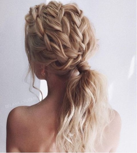 a low ponytail with fully braided top and some locks down is a very fresh and modern idea