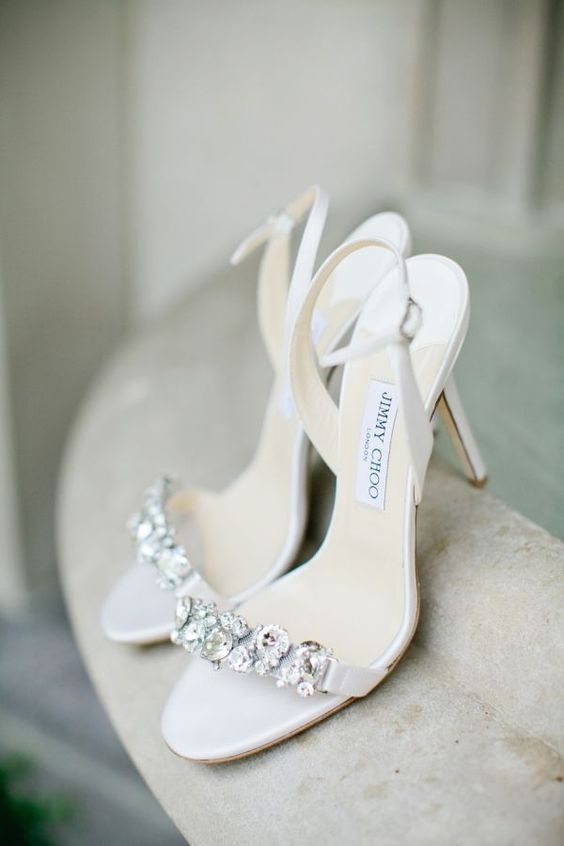 elegant and delicate off-white wedding shoes with embellished tops and ankle straps are a chic and cool idea