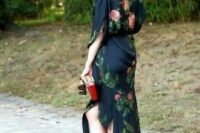 18 a dramatic navy fall wedding guest dress with rose prints, an asymmetrical skirt, short sleeves, black shoes and a box clutch