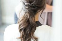 18 a low ponytail with twists and waves and no detailing and accessories for a modern bride
