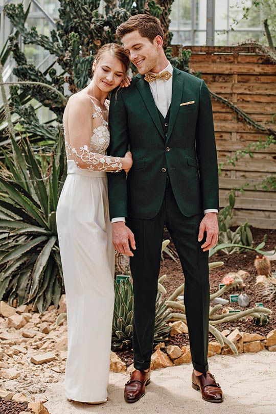a cool three-piece groom's suit with a white shirt, a mustard bow tie and brown shoes with no sorcks for a fall wedding