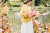 19 an oversized mustard cardigan will accent your bridal look and keep you warm at the same time