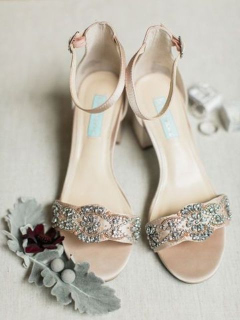 a pair of beautiful vintage inspired embellished nude wedding shoes with block heels and ankle straps are adorable