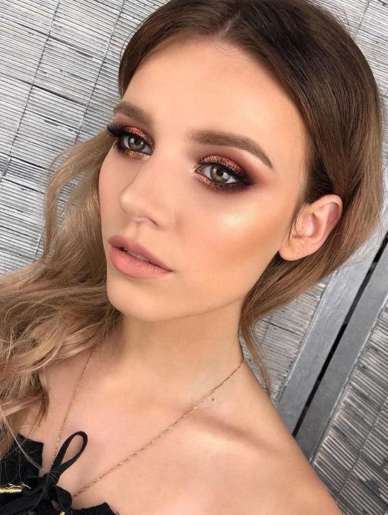 a bold pink smokey eye, a touch of blush and highlighter, a matte nude lip not to distract attention from the eyes