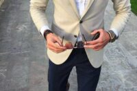 21 a classic yet modern look with navy pants, a white shirt, a creamy blazer and brown moccasins