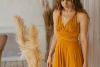 23 a cool honey yellow maxi bridesmaid dress with a daped bodice and tied waist for a boho wedding