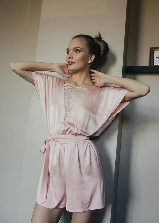 pink silk pajamas with a laced up neckline and a sash is a cool alternative to a robe or a dress