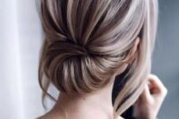 24 an elegant low updo with a dimensional bump and locks down is a stylish modern hairstyle