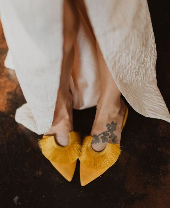beautiful marigold wedding shoes with no heels and fringe detailing are amazing for a boho bride, they will add color
