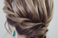 25 an exquisite low bun with a braided halo and a voluminous top plus locks down is very chic