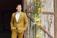 27 a stylish groom’s look with a mustard tux, brown shoes, a white shirt and a floral boutonniere for a spring wedding