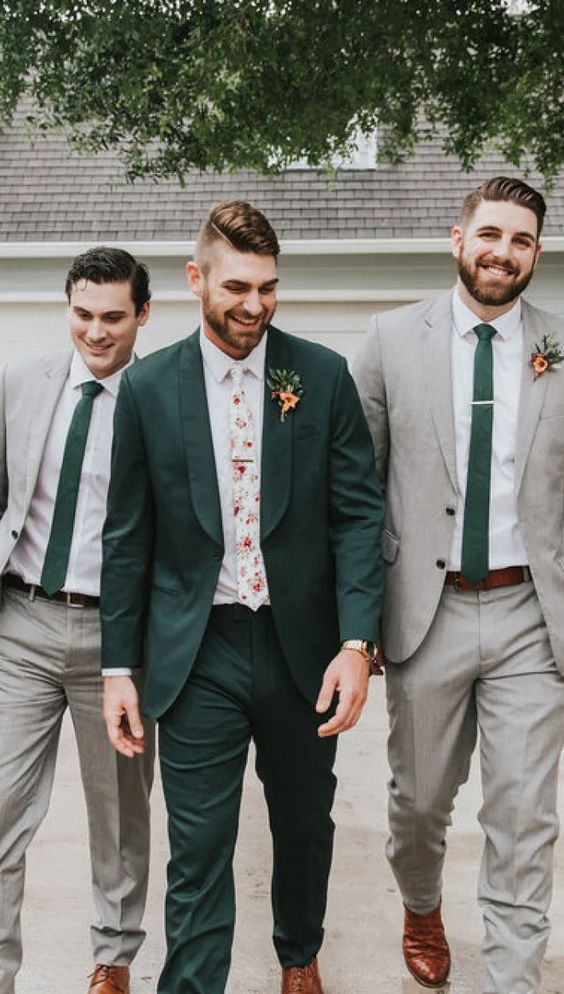 a green pantsuit, a white shirt, a floral tie and amber shoes are a cool combo for a summer or fall wedding