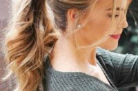 29 a wavy ponytail with a fishtail braid on one side and some bangs is a relaxed and casual wedding hairstyle idea