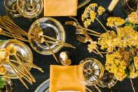 30 a bold and catchy spring tablescape with sheer glass plates, yellow napkins and blooms and gold cutlery is very modern
