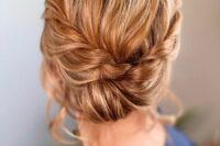 32 an elegant low updo with a braided halo and a low bun plus some volume on top is a cool and chic idea