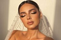 33 a bold bridal smokey eye makeup with shiny lilac smokeys, a glossy nude lip, a touch of blush and highlighter