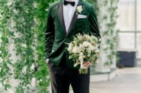 34 an elegant groom’s look with an emerald velvet blazer with black lapels, a bow tie and black shoes