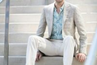 34 an elegant tropical wedding guest look with a printed grene shirt, creamy pants, a neutral textural blazer and brown loafers