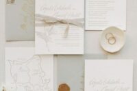 35 a lovely neutral wedding invitation suite with grey envelopes, white invitations with grey fabric ribbon and a hand painted map