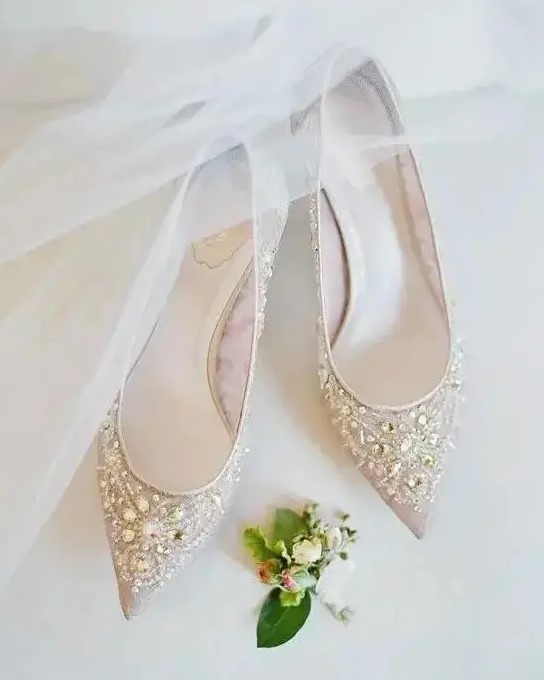 nude pointed toe heavily embellished flats are a chic option for any wedding, they will provide comfort if you are used to wearing heels