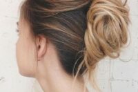 37 a messy and chic French twist chignon with a messy and layered top and a messy low bun