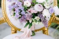 37 a sophisticated wedding bouquet of lilac, white and blush blooms and greenery plus long blush ribbons is a stylish and chic idea