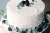 37 a white textural wedding cake topped with blackberries and fresh greenery is a cool and lovely solution for a fall wedding