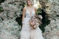 39 a lush wedding arch covered with white and blush baby’s breath is a heavenly beautiful idea for a spring or summer wedding