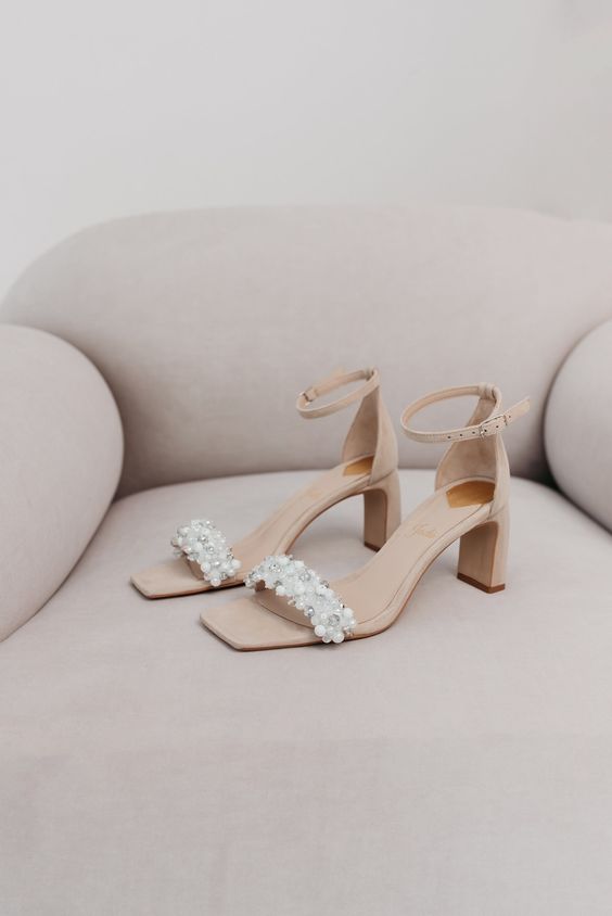 nude suede wedding shoes with ankle straps, low comfy heels and embellished tops are adorable for a bride