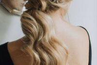 40 a low wavy ponytail with a messy top accented with a cool shiny star headcomb is a gorgeous idea