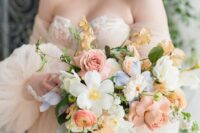 42 a delicate pastel wedding bouquet with neutral, blush, coral and blue blooms and greenery is a very cool and chic spring idea