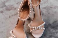 43 nude wedding shoes with pearl detailing and criss cross straps are a chic and glam idea for a wedding