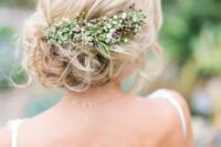 44 a romantic wavy side updo with a volume on top and a fresh flower and greenery hairpiece for a natural feel
