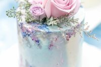 45 a light mint blue wedding cake with pink and blue touches and pink roses and greenery on top is gorgeous for spring