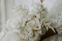 45 a refined wedding bouquet composed of only white blooms – roses, calla lilies, dahlias and leaves is amazing for summer