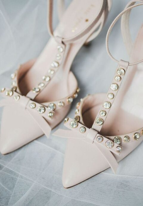 refined nude wedding shoes with T straps, bows and embellishments are a gorgeous idea for a refined bridal look
