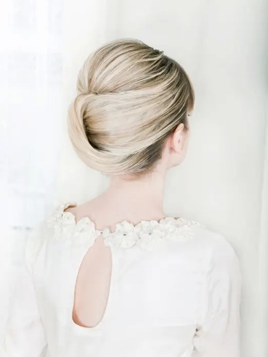 a sweet and tight French twist updo with a volume on top on balayage hair is very stylish and chic