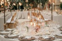 49 a stylish neutral summer wedding tablescape with a lush textural green centerpiece with bulbs, woven placemats and neutral porcelain