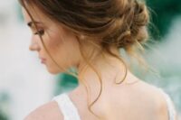 49 a very chic wavy low updo with a volume on top and some locks down is a great option for many bridal looks