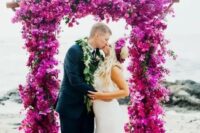 50 a fantastic hot pink and fuchsia wedding arch totally covered with blooms is a bright and statement-like idea for a wedding