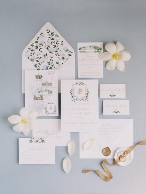 a stylish summer wedding invitation suite with painted maps and a palace, hydrangea lining and calligraphy is amazing