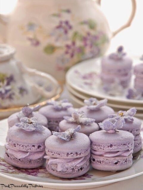 pretty and cool lilac macarons topped with matching sugared flowers are amazing for a spring or summer wedding