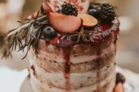 51 a naked wedding cake with berry drip, fresh fruits and berries is a gorgeous idea for a fall wedding