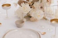 51 a warm neutral wedding tablescape with neutral linens, neutral florals, gold and creamy glasses, neutral plates and gold cutlery