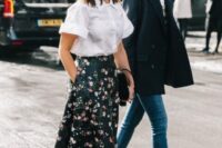52 a pretty wedding guest look with a white shirt with short sleeves, a refined black maxi skirt with pink floral prints, black shoes and a black bag